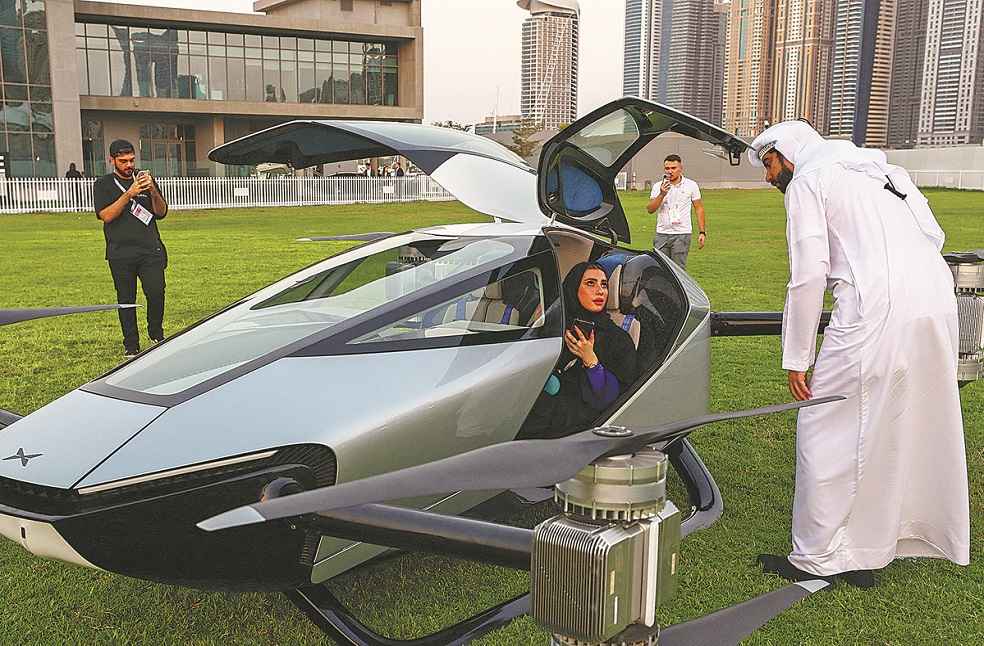 Guests and reporters check out XPeng's flying car _ World Automobile Day